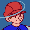 wooden boy wearing red newsboy cap